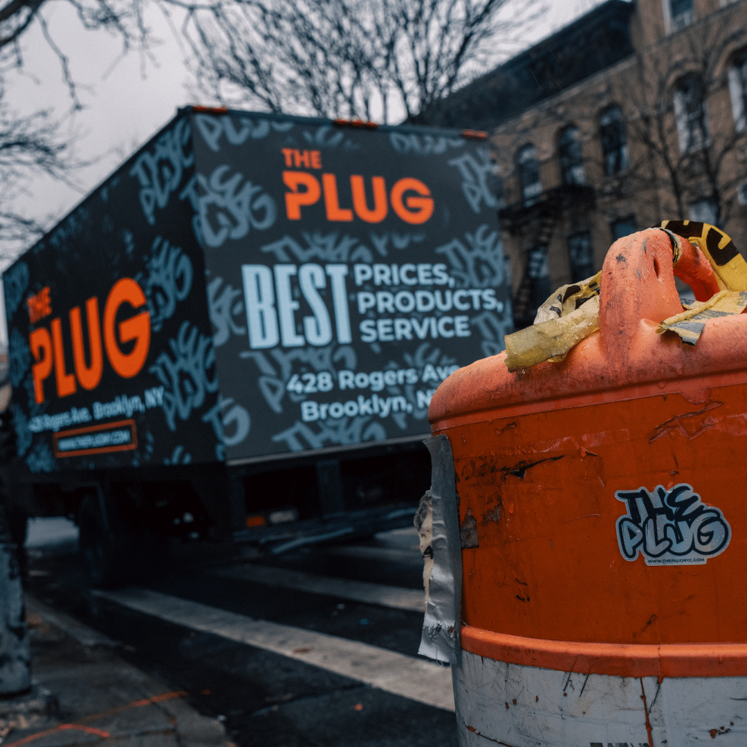 The Plug dispensary truck with sign