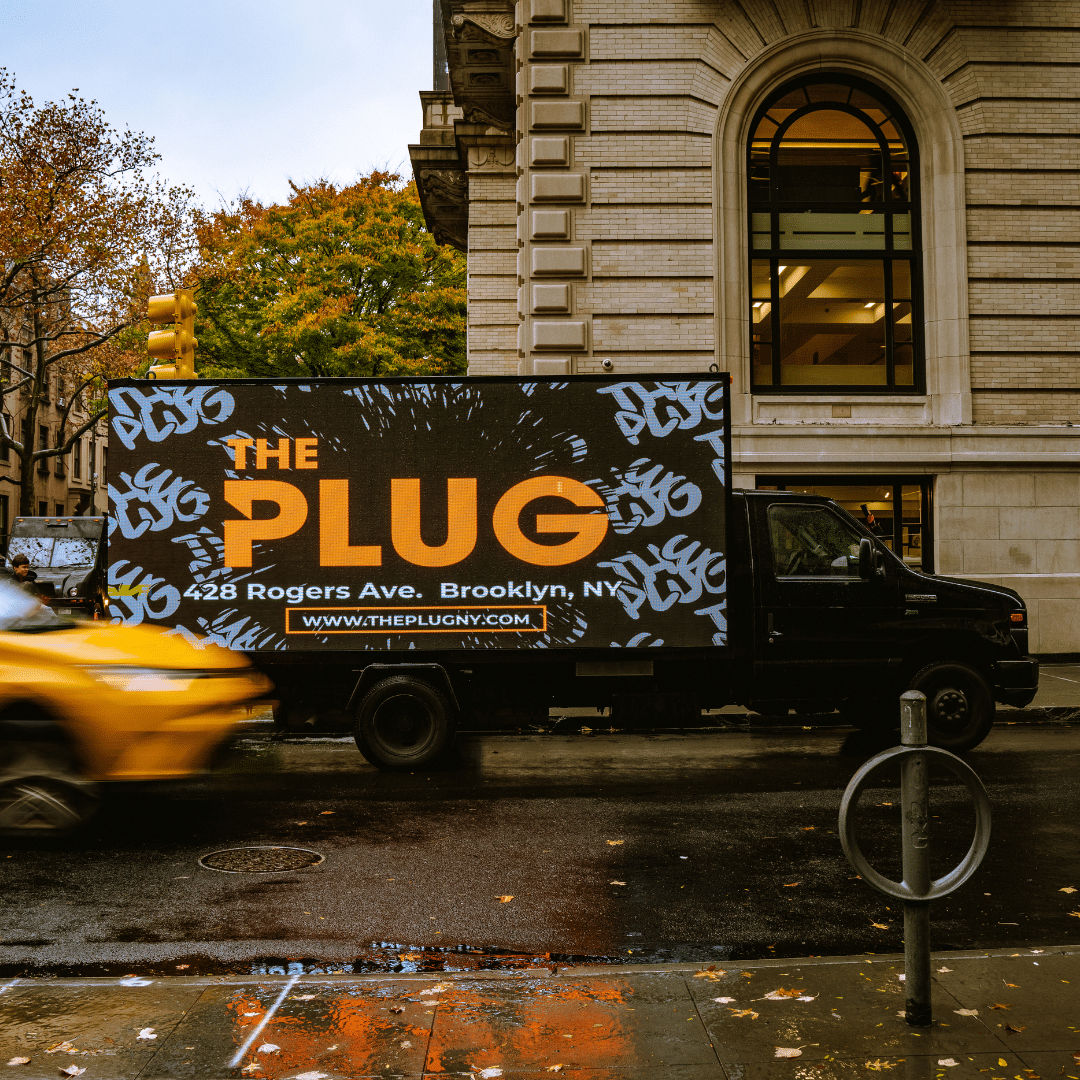 The Plug dispensary truck with sign